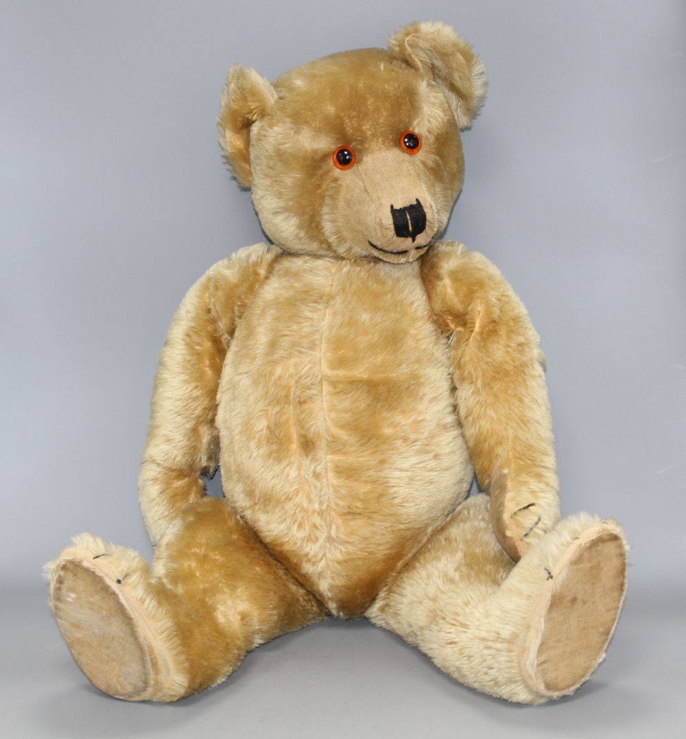 A Chiltern Hugmee 1930s bear, 25in., velvet pads, bald patch back of both legs and also back of neck